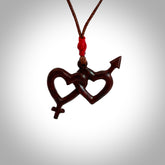 Hand carved double heart pendant made in your choice of black jade or jasper stone. Made by NZ Pacific. Carved from Red Jasper Stone and Black Jade. Black jade and red jasper stone heart with his and her symbols. Free delivery worldwide.